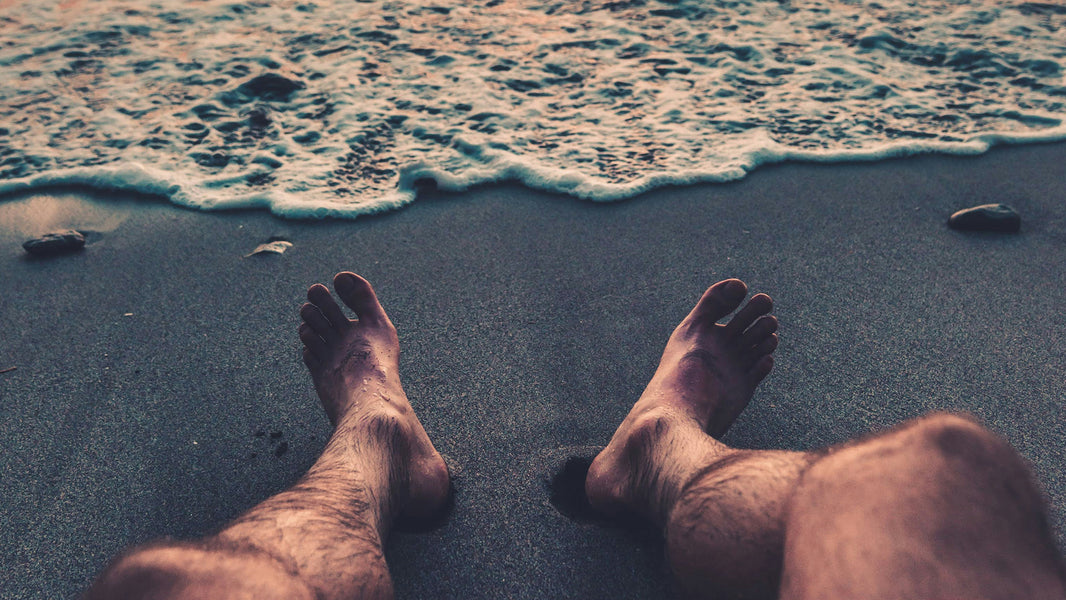 Image of men's feet for an article about footcare.